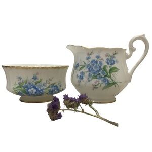 Royal Albert  creamer and Paragon sugar bowl.